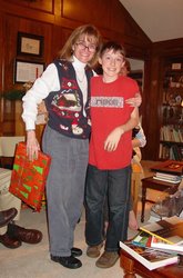 Nancy holding a Christmas-wrapped package, with Willie